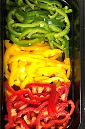 Trays of green yellow and red peppers associated with the Subway pepper dispute