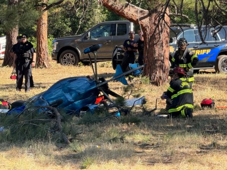 Douglas County sheriff's deputies and Larkspur Fire Protection District firefighters respond to a small helicopter crash near Larkspur, Colo., on Monday, July 13, 2026. (Photo provided by the Larkspur Fire Protection District)