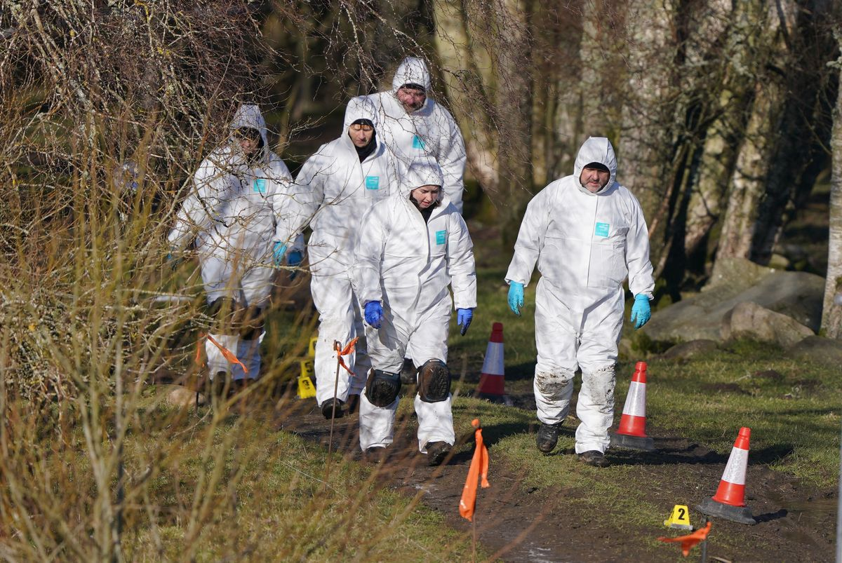 Police at the scene in the Pitilie area on the outskirts of Aberfeldy, Perthshire after 65-year-old Brian Low was found dead next to his dog