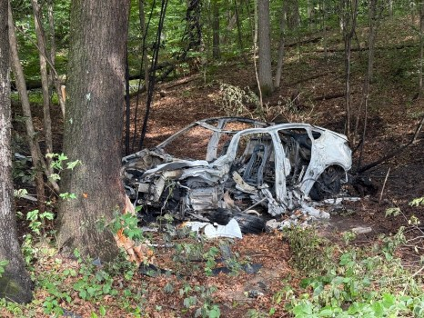 An electric vehicle burst into flames after a crash on Gay Road in Groton on Aug. 5, 2026. Four people were hospitalized, including two who were transported by medical helicopter. Christopher’s Towing, which is certified in electric vehicle transport and recovery, removed the vehicle from the scene. (Courtesy photo)