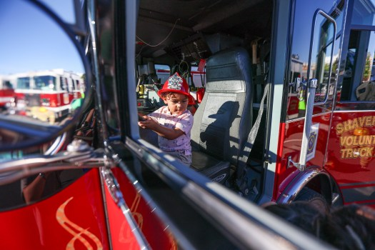 Atlas Bell, 2, of Dallas, sits in the front seat of a Shavertown Volunteer Fire Department engine during the Dallas Twp. Police Department National Night Out at Misericordia University on Tuesday, August 4, 2026. (JASON ARDAN / STAFF PHOTOGRAPHER)
